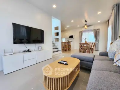 Spacious modern living room with open kitchen and stylish decor