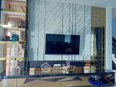 Modern living room with stylish TV wall and elegant decor