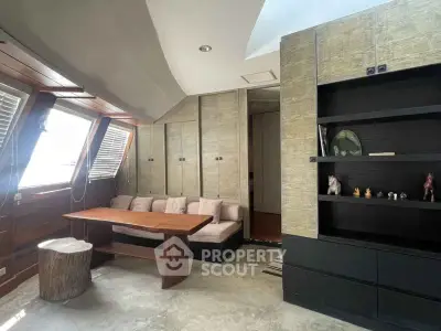 Chic living room with modern built-in shelving and cozy seating area.