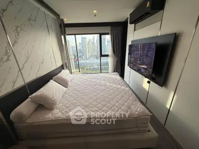 Luxurious bedroom with city view and modern decor in high-rise apartment