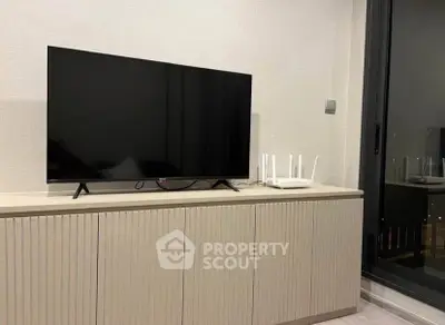 Modern living room with sleek TV setup and stylish cabinet