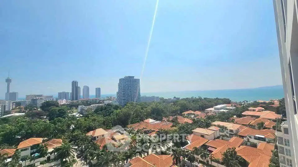 Stunning cityscape view with ocean horizon and lush greenery, perfect for urban living enthusiasts.