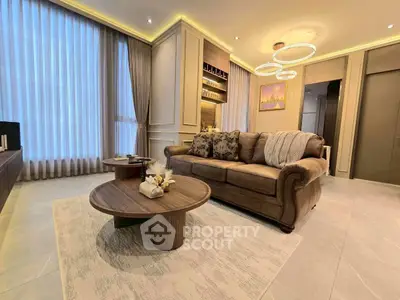 Luxurious living room with elegant decor and ambient lighting, perfect for relaxation.