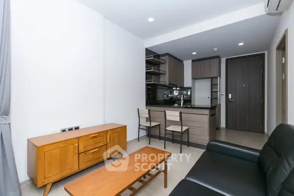 Modern living room with open kitchen and stylish furniture