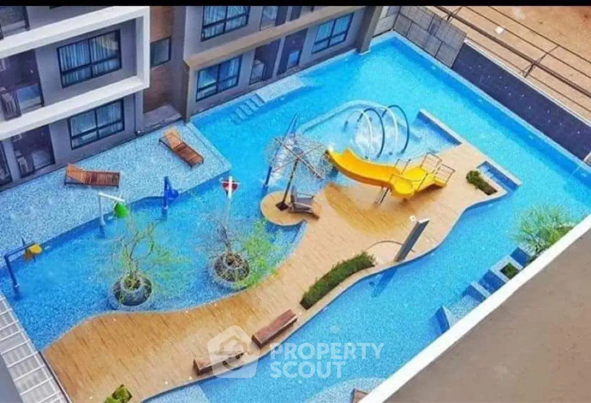 Luxurious apartment complex with stunning pool and play area, perfect for family relaxation and entertainment.