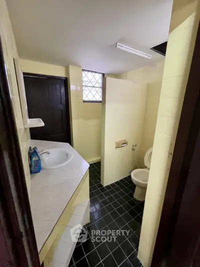 Cozy bathroom with vintage yellow tiles and modern fixtures