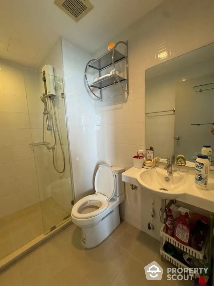 Modern bathroom with glass shower and sleek fixtures