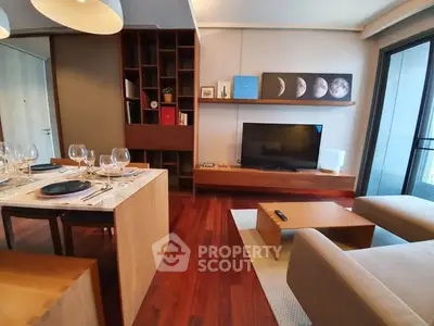Modern living room with elegant dining area and balcony view