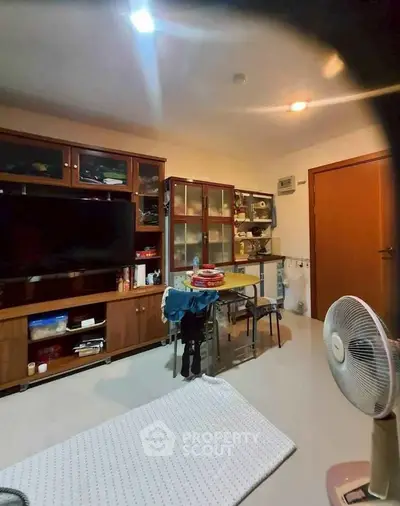 Cozy living room with wooden cabinets and modern decor