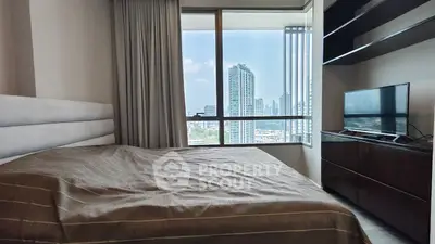 Modern bedroom with city view, featuring a cozy bed and sleek TV setup.