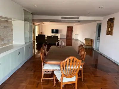 Spacious living room with elegant dining area and modern decor