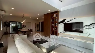Luxurious modern living room with elegant marble accents and spacious open layout.