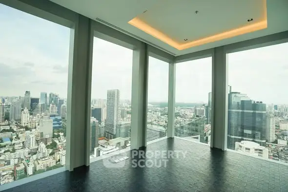 Stunning corner unit with panoramic city views from floor-to-ceiling windows.