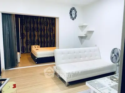 Modern studio apartment with stylish decor and cozy bedroom area