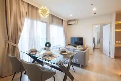 Modern living room with elegant dining area and natural light