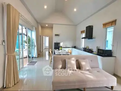 Spacious open-layout living room with modern kitchen and elegant decor