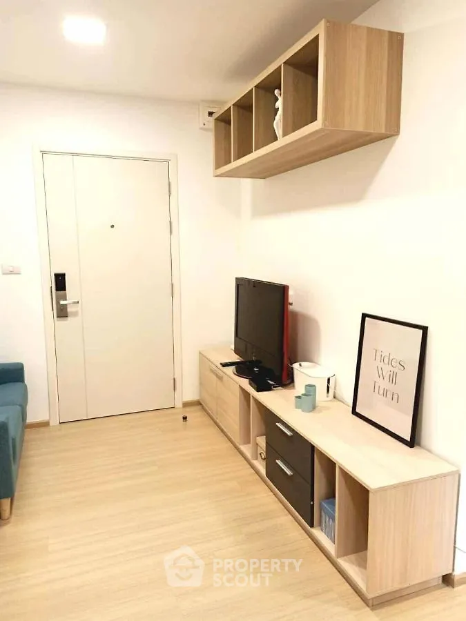 Modern living room with stylish TV stand and wall-mounted shelves