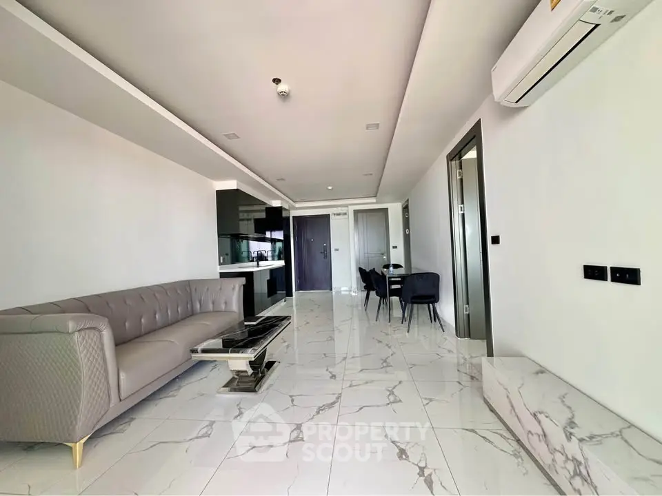 Modern living room with sleek marble flooring and elegant furniture