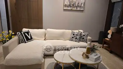 Elegant living room with cozy white sofa and stylish decor