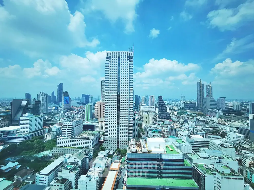 Stunning cityscape view showcasing modern skyscrapers under a vibrant blue sky, perfect for urban living enthusiasts.