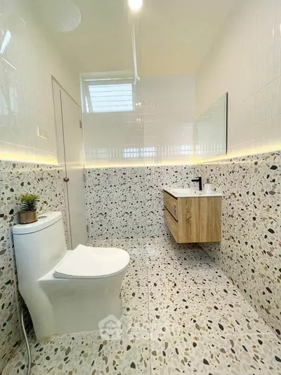 Modern bathroom with terrazzo tiles and floating vanity