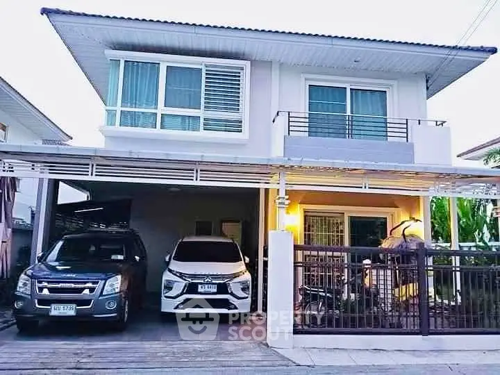 Modern two-story house with spacious carport and sleek design