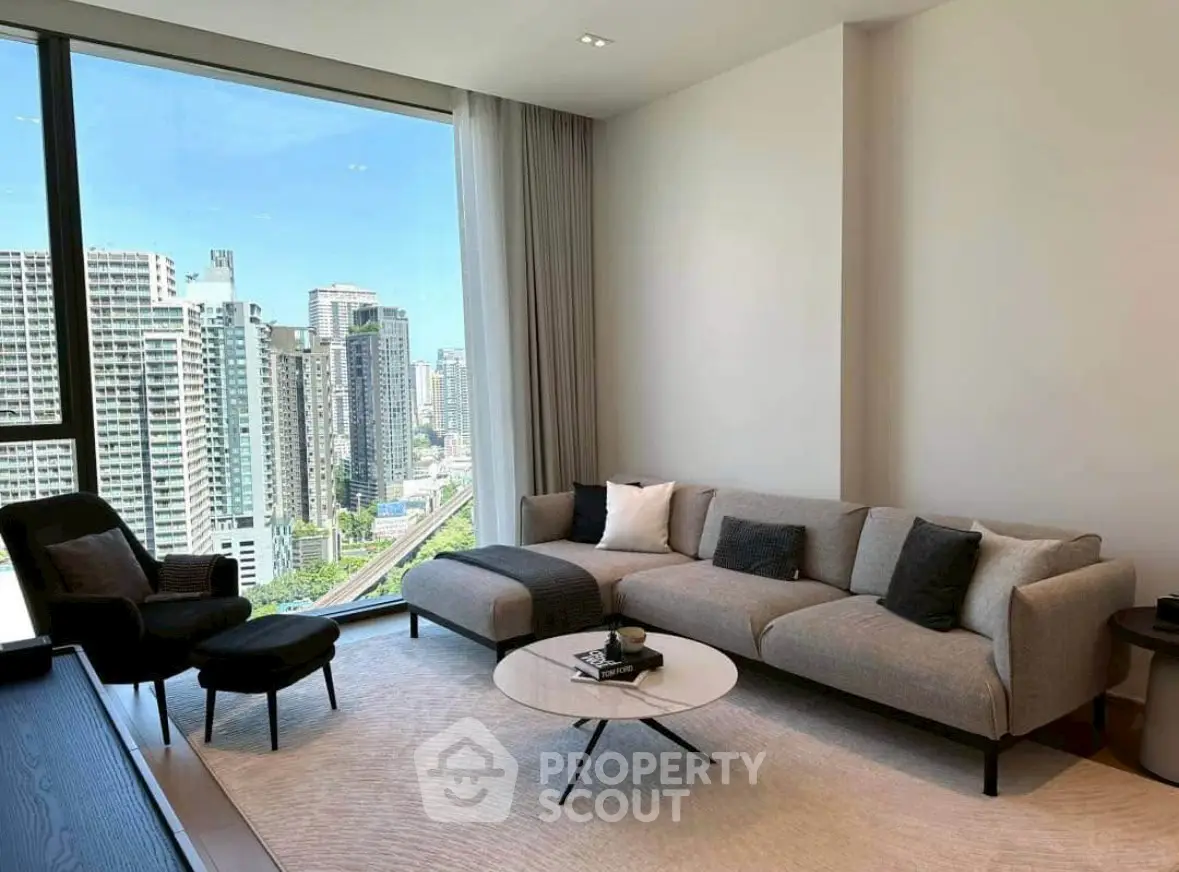 Modern living room with panoramic city view and stylish furniture.