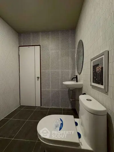 Modern bathroom with sleek design and minimalist fixtures.