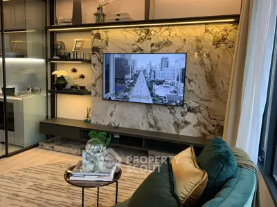 Luxurious living room with marble wall and modern decor, featuring a mounted TV and elegant shelving.