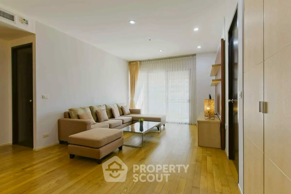 Spacious living room with modern decor and natural light