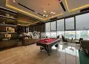 Luxurious living room with pool table and modern decor