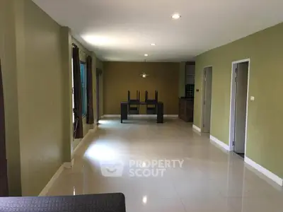 Spacious living room with modern design and ample natural light
