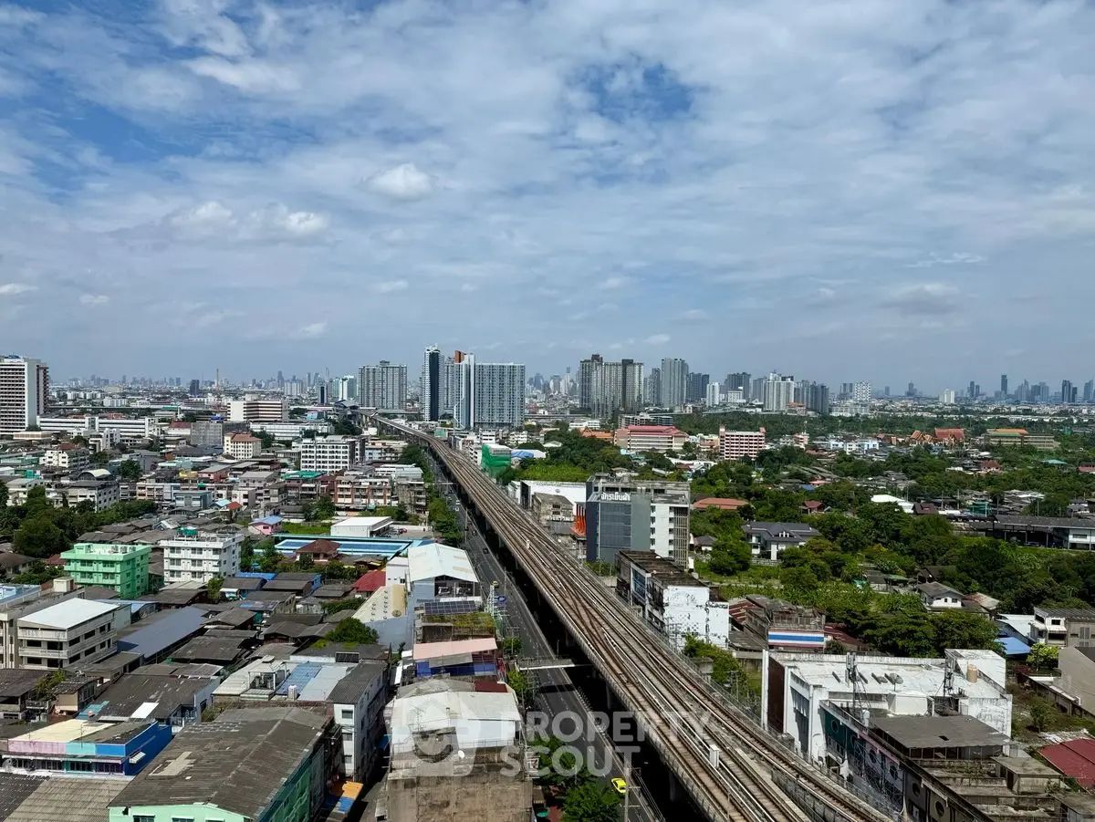 Stunning cityscape view with skyline and railway, showcasing urban living and development.
