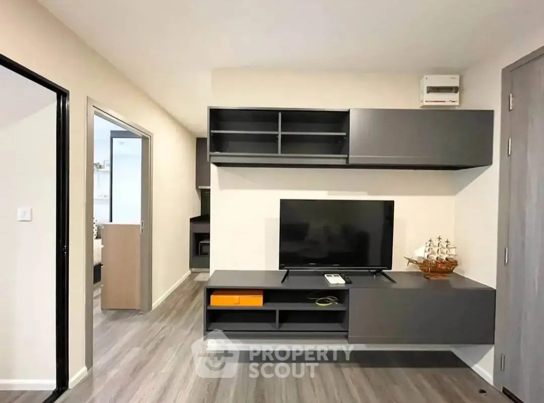 Modern living room with sleek TV unit and stylish shelving, perfect for contemporary living.