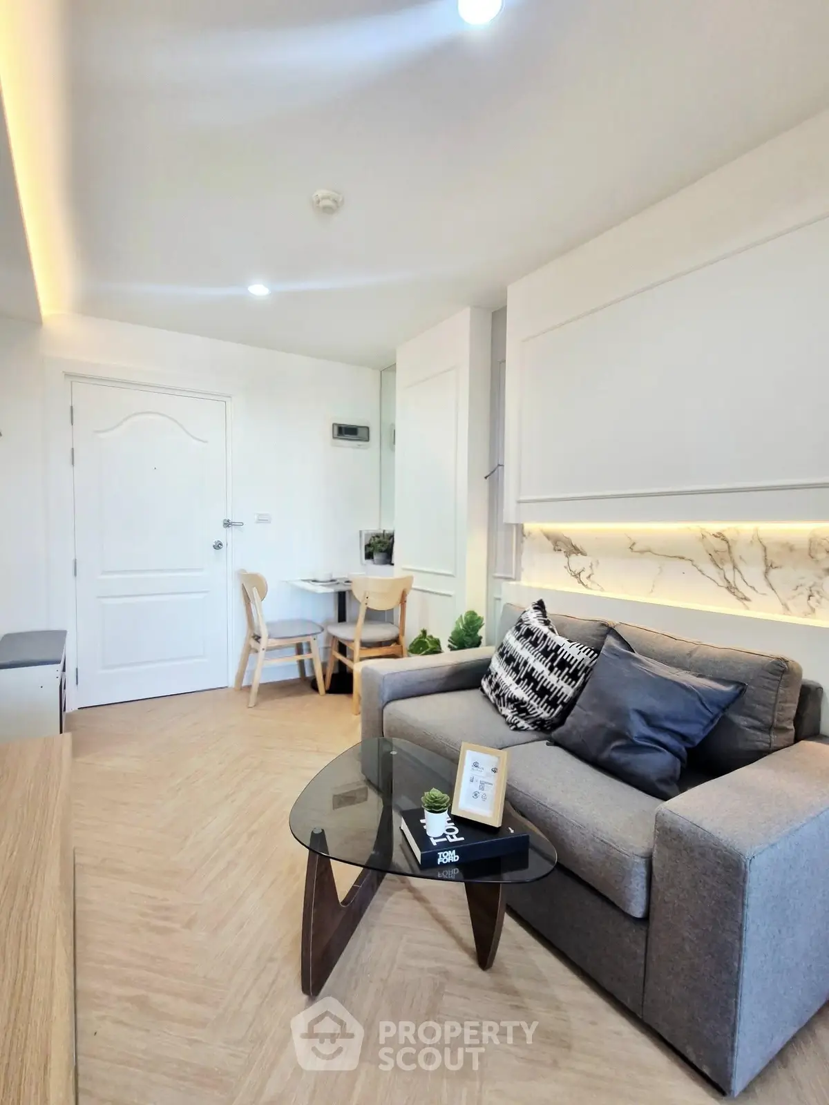 Modern living room with stylish decor and cozy seating area, perfect for relaxation and entertaining.