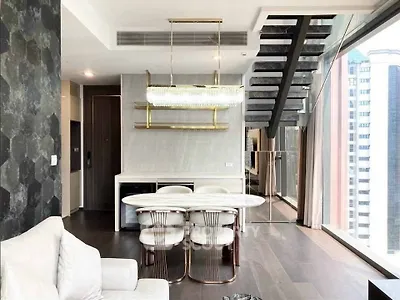 Luxurious modern living room with elegant dining area and stunning city view.