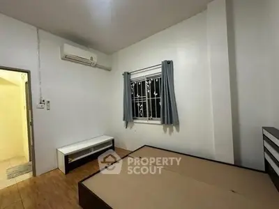 Spacious bedroom with air conditioning and minimalist design