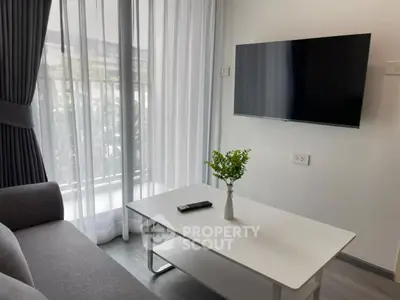 Modern living room with wall-mounted TV and elegant decor
