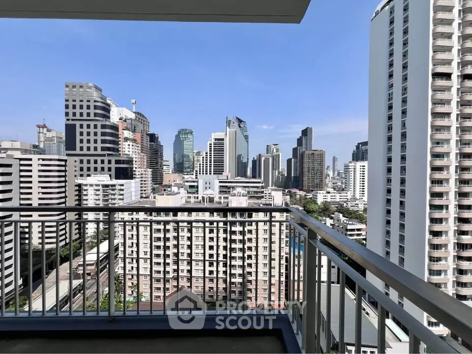 Stunning cityscape view from a high-rise balcony, showcasing modern urban living.