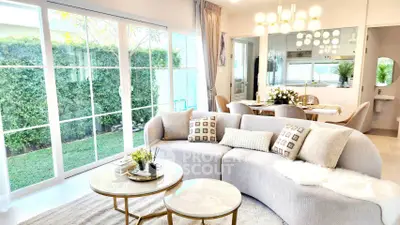 Elegant living room with modern decor and garden view