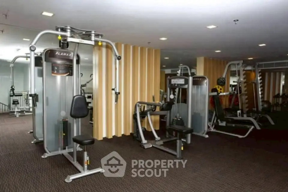 Modern gym with state-of-the-art fitness equipment in a residential building.