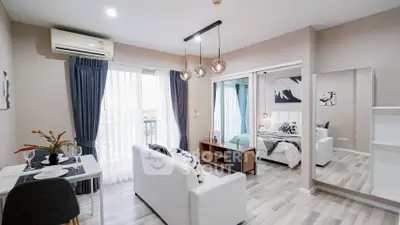 Modern open-plan living room with stylish decor and natural light