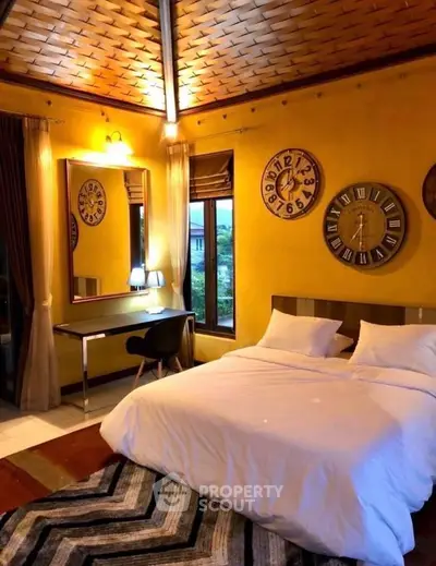 Cozy bedroom with stylish decor and large window view