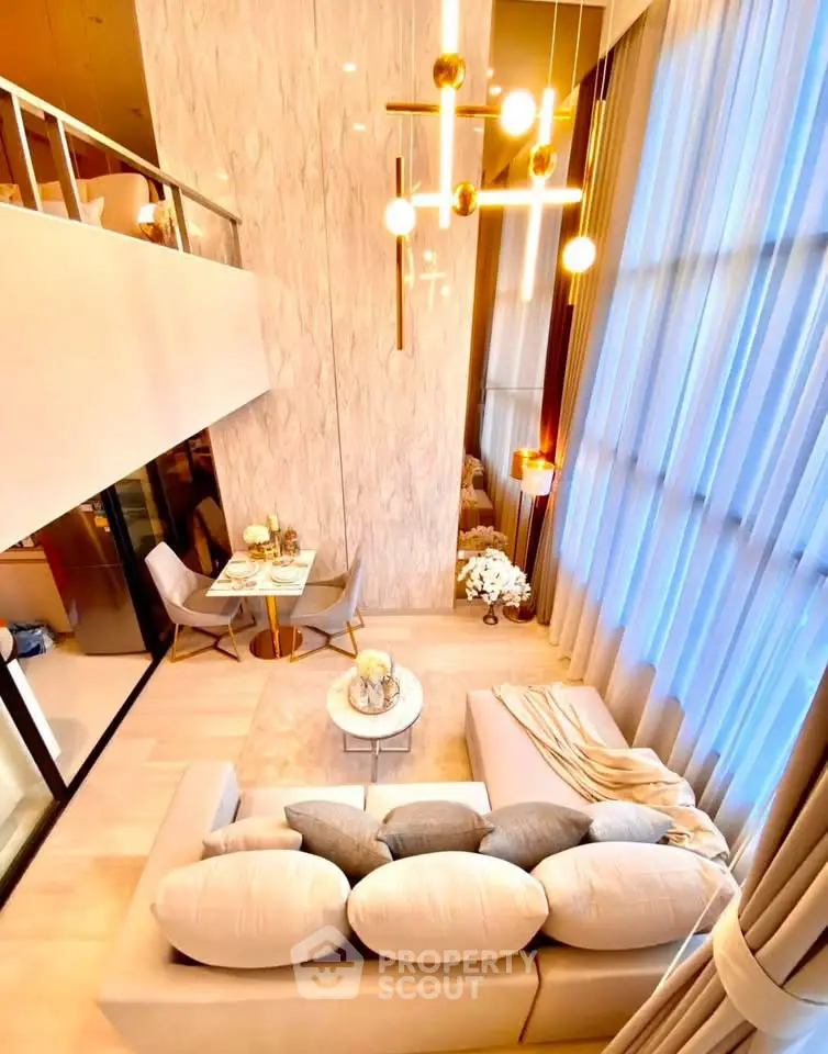 Luxurious modern living room with high ceilings and elegant decor in a duplex apartment.