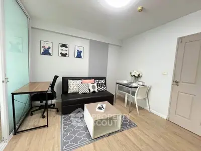 Chic modern living room with stylish decor and cozy seating area, perfect for relaxation and work-from-home setup.