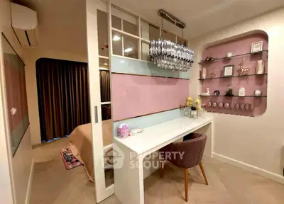 Chic study area with modern decor and elegant lighting in a stylish apartment.