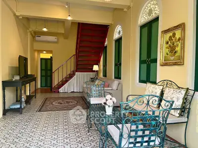 Charming vintage living room with ornate metal furniture and vibrant decor