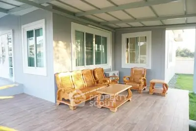 Charming outdoor patio with wooden furniture and garden view