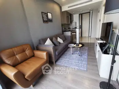 Modern living room with stylish furniture and open kitchen layout