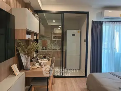 Modern studio apartment with open kitchen and cozy living area
